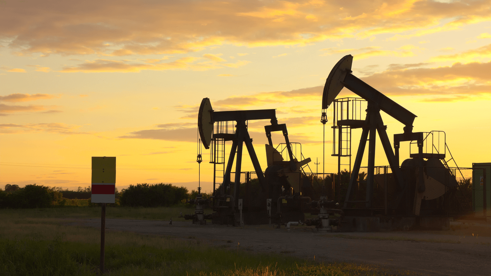 Oil wells at dusk