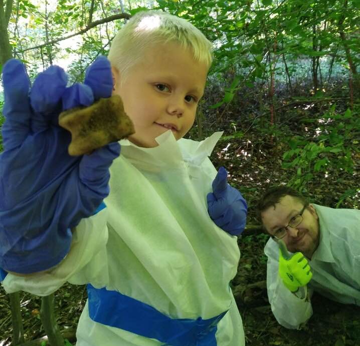 Our executive director and his nephew during an educational exercise; Odin is holding a bone from a deer