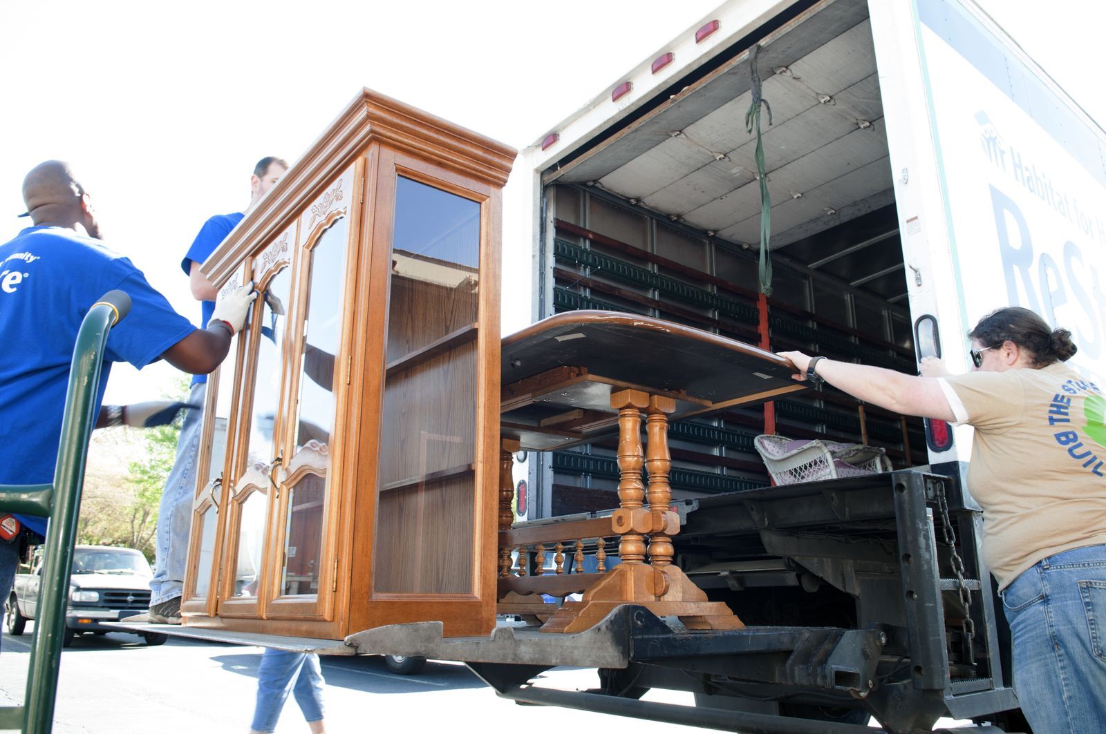 Man and woman loading furniture on a truck