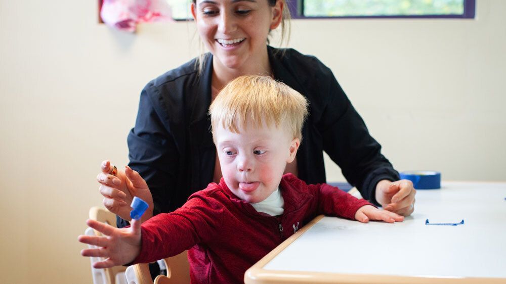 Child and Occupational Therapist working together