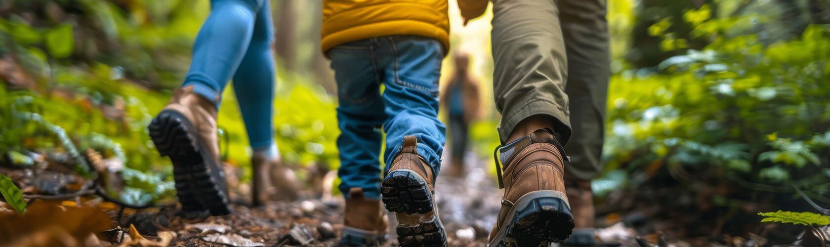 Child walking with parents on NC trail