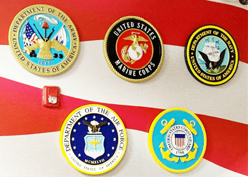 IP-1162 - -  Set of Five Carved Plaques of the Seals of the Five Armed Forces, Mounted on Wall with Flag Striped Background