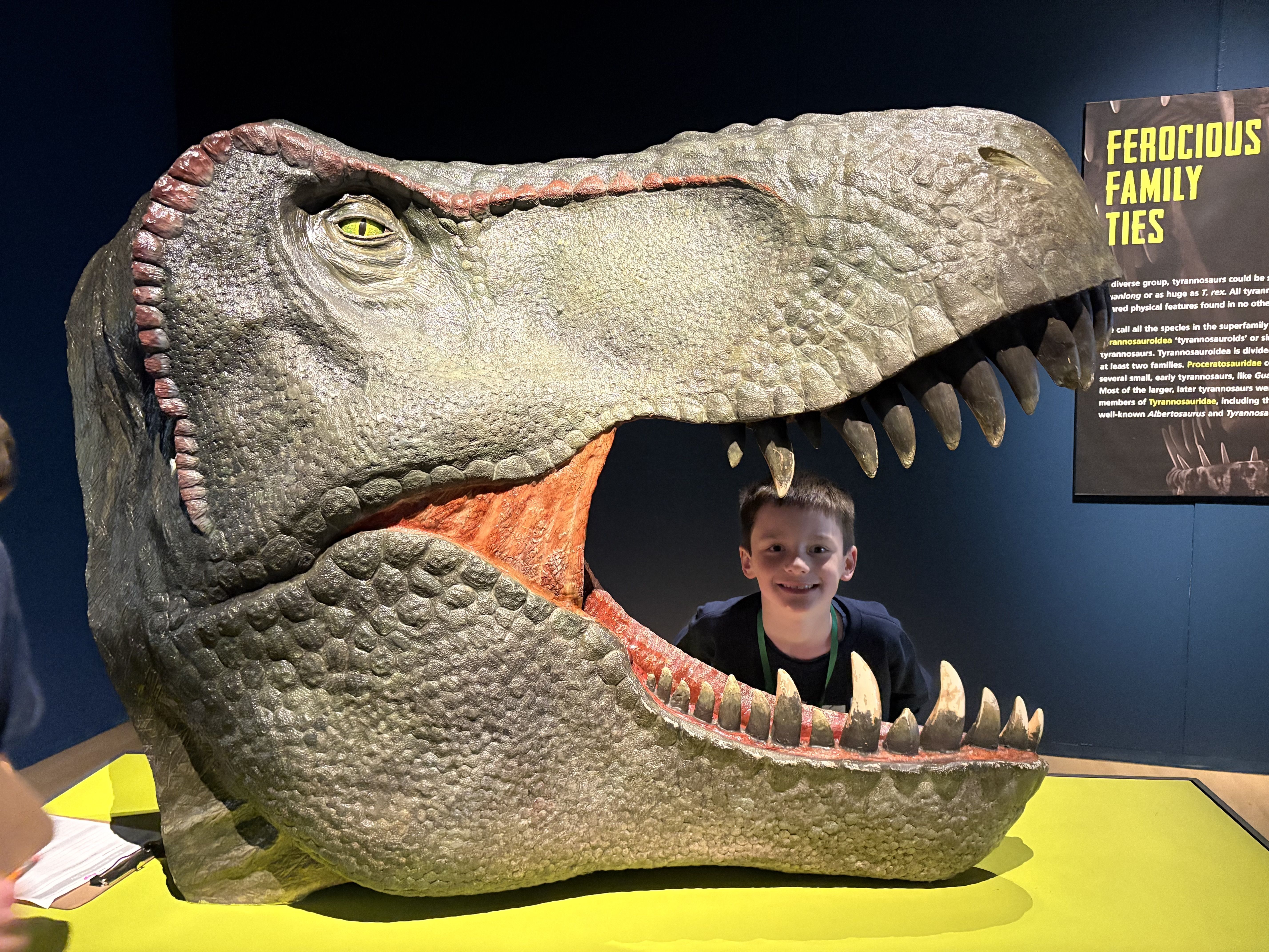 photo of student behind dinosaur head