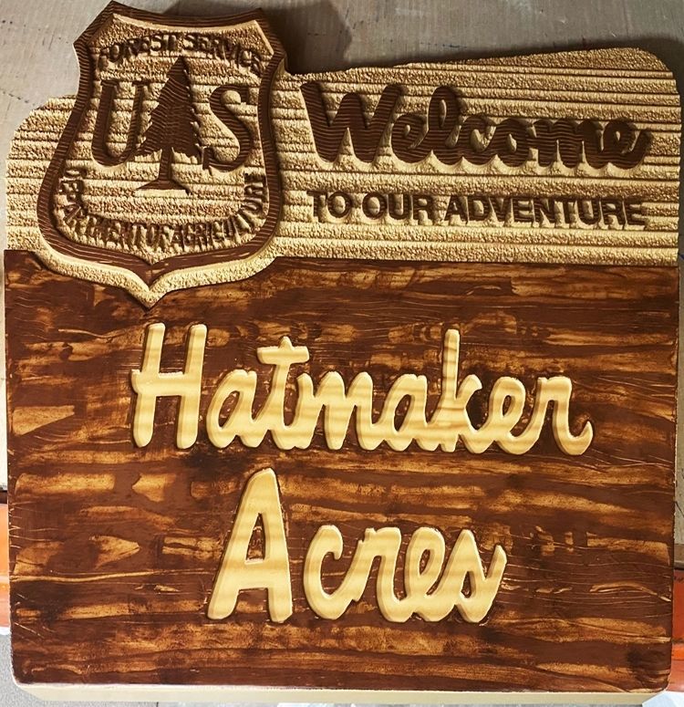 M22003 - Rustic Carved 2.5-D  Relief HDU Property Name  Sign "Hatmaker Acres", with US Forest Service  Emblem as Artwork.