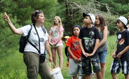 Students in an education program on the Maxwell Mays Wildlife Refuge trails with Audubon Educator Tracey Hall.
