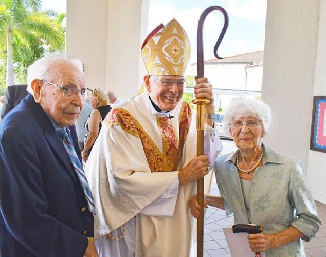 Bishop Barbarito and Mr. and Mrs. White. Picture taken by Aleen Stanton