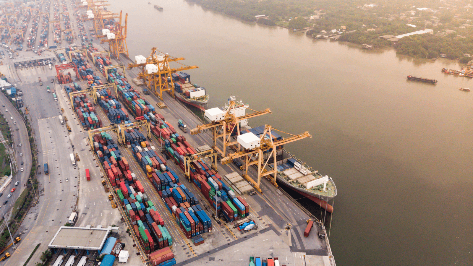 Shipping containers and boats on river