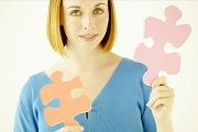 Blond Woman Holding 2 Puzzle Pieces