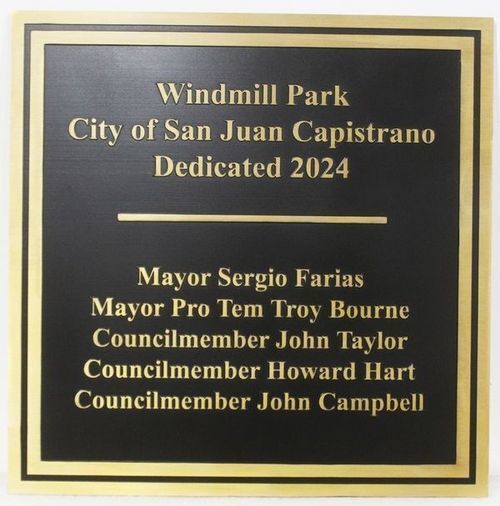 Windmill Park Dedication Plaque – A formal black and gold plaque commemorating the 2024 dedication of Windmill Park in San Juan Capistrano, listing city officials including the mayor and councilmembers.