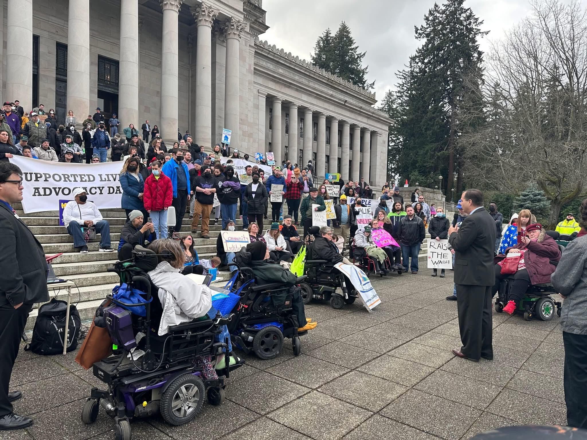 People advocating outside of a capital buildilng