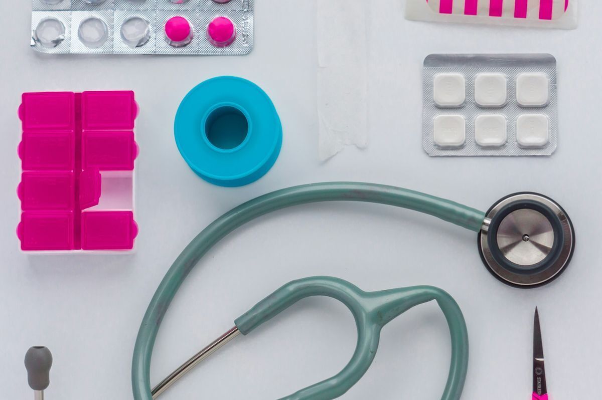 a stethoscope, bill boxes, and other medical tools. 