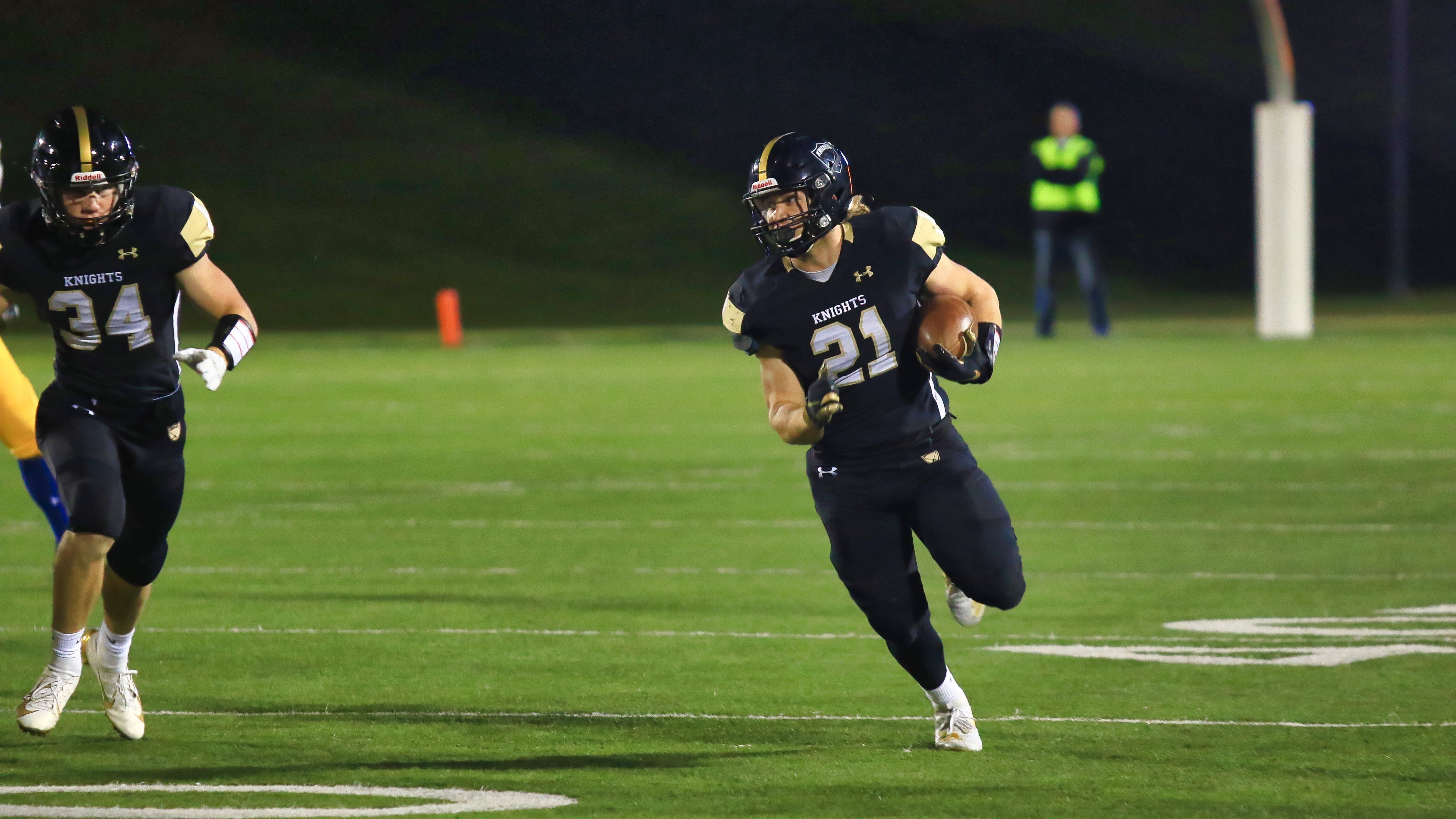 two football players on field