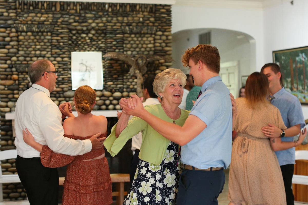 An image of people dancing in the Fireplace Room, adjacent to the Sun Room.