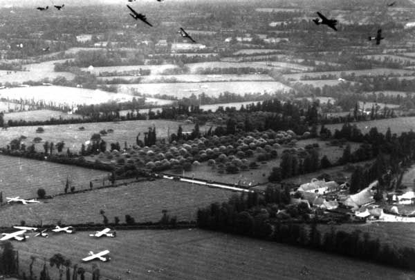 C-47s releasing gliders over a landing zone, June 6, 1944