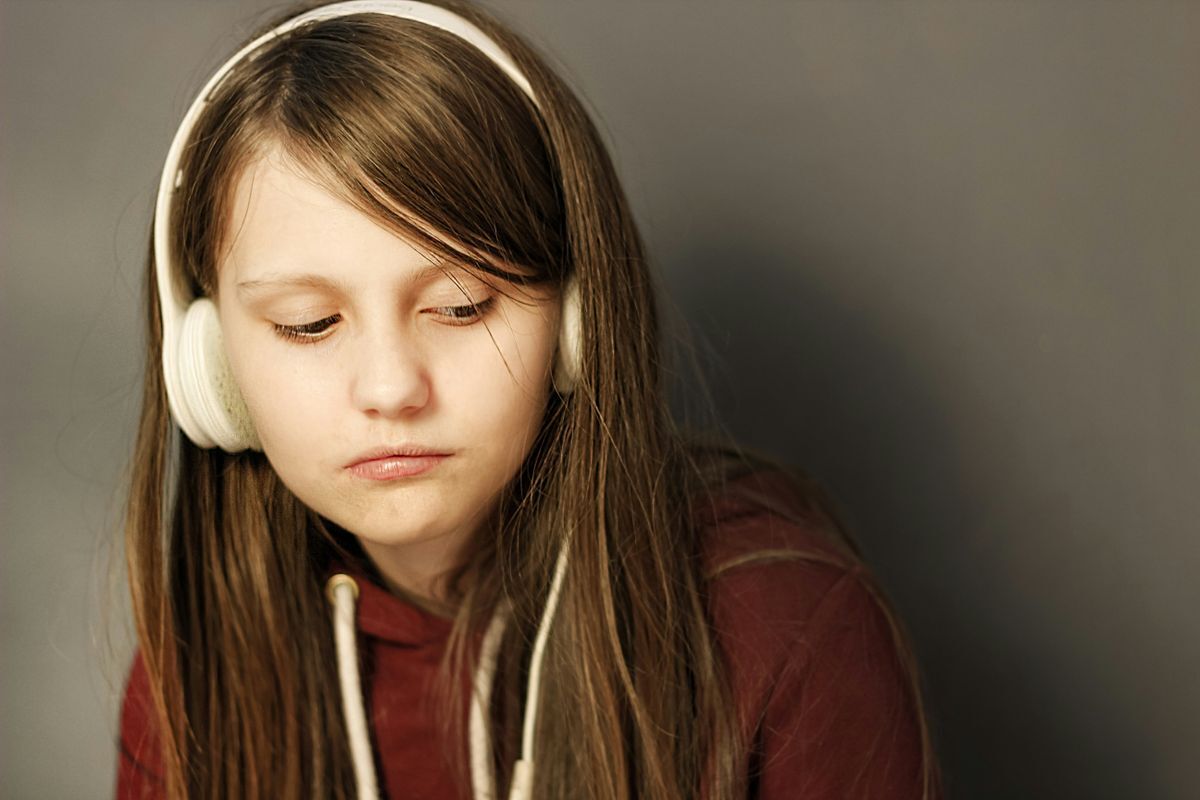 teen girl wearing headphones