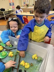 Toddler playgroup with teachers.