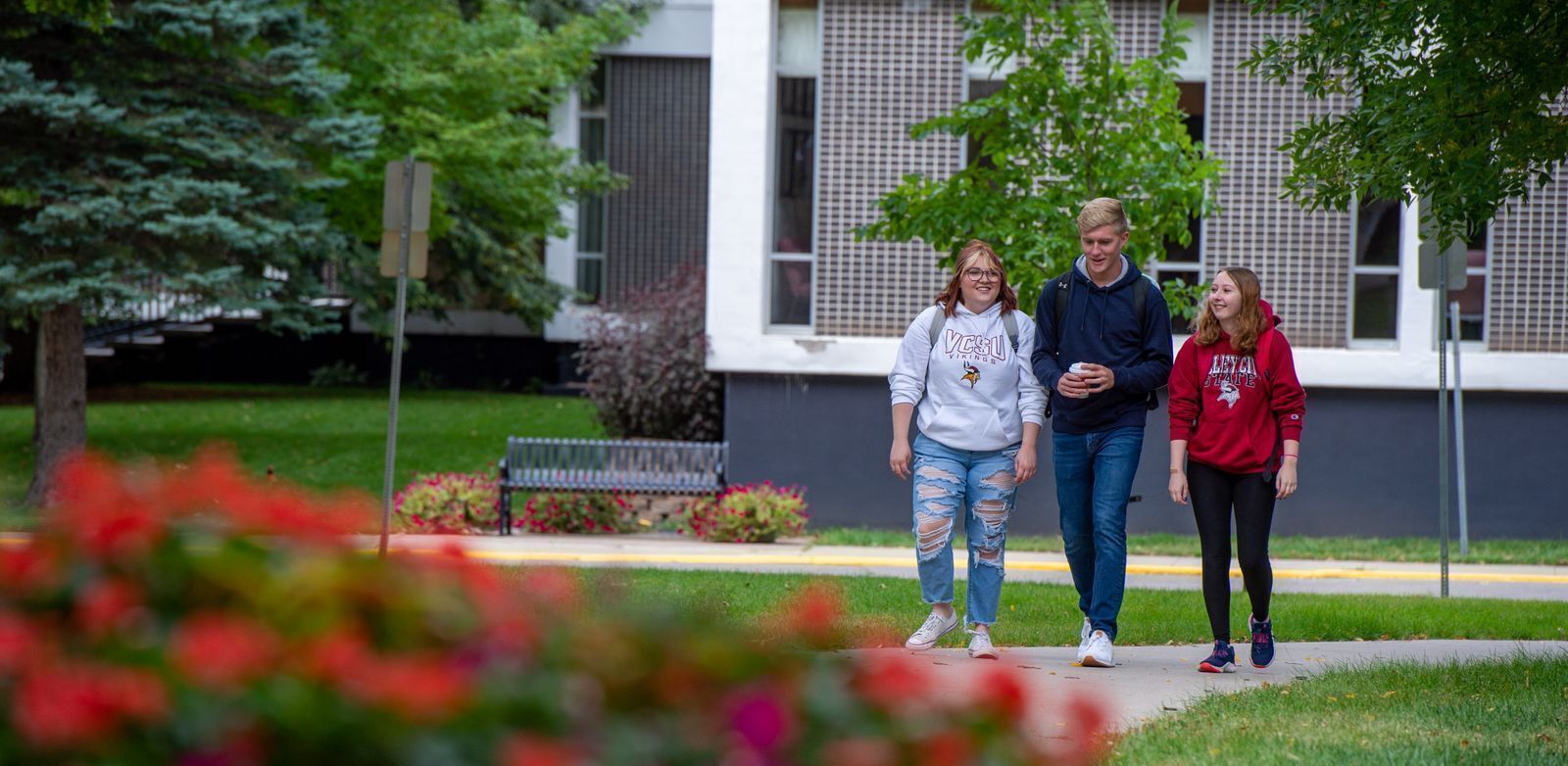 Three students walking in front of the Student Center