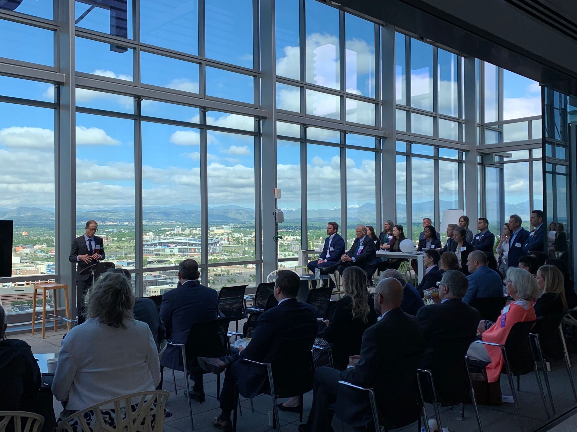 Professor Joshua Wilson of the University of Denver addresses the audience at CJI's Member Breakfast held in June 2022