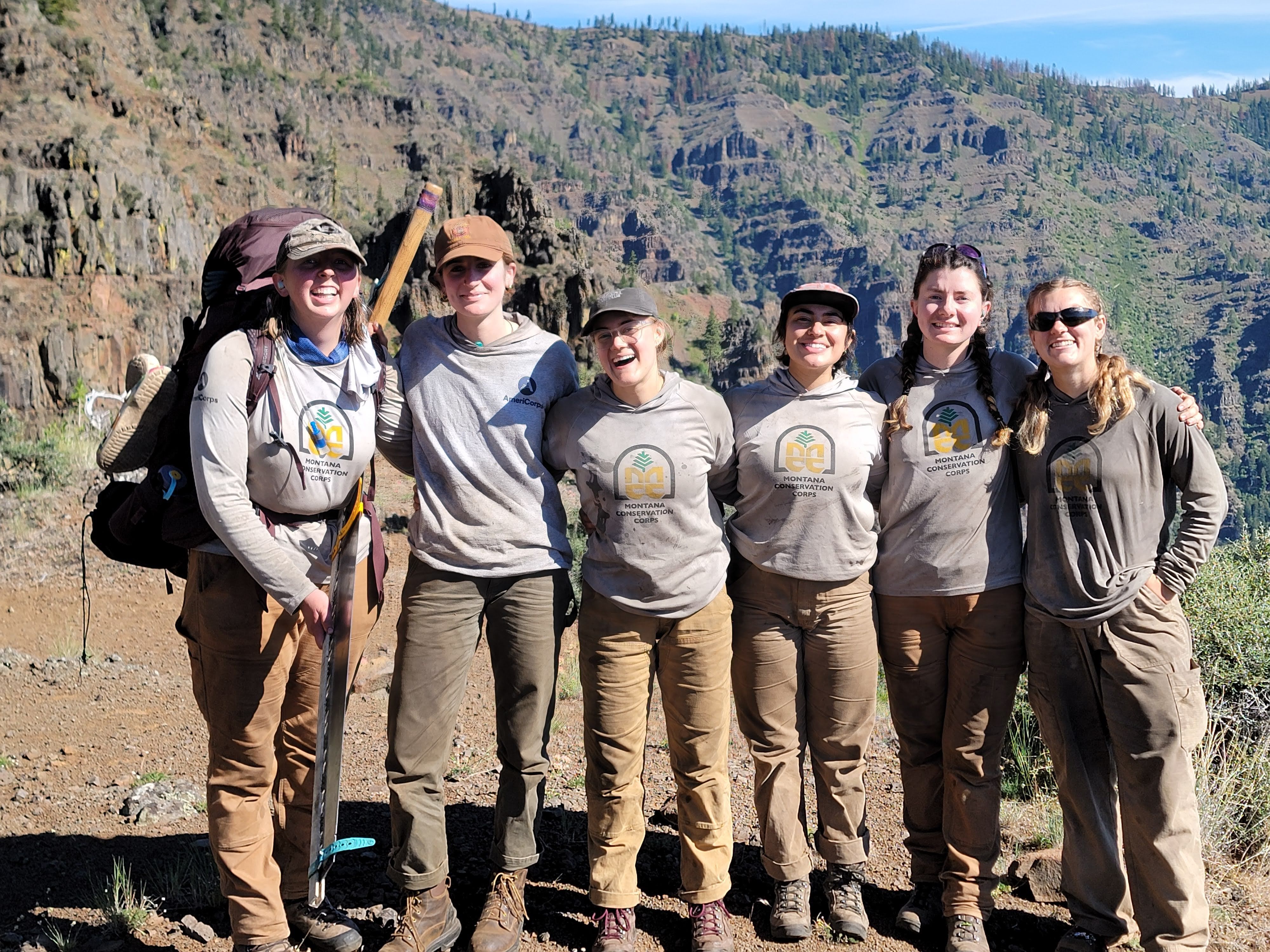 A crew standing in a burn area