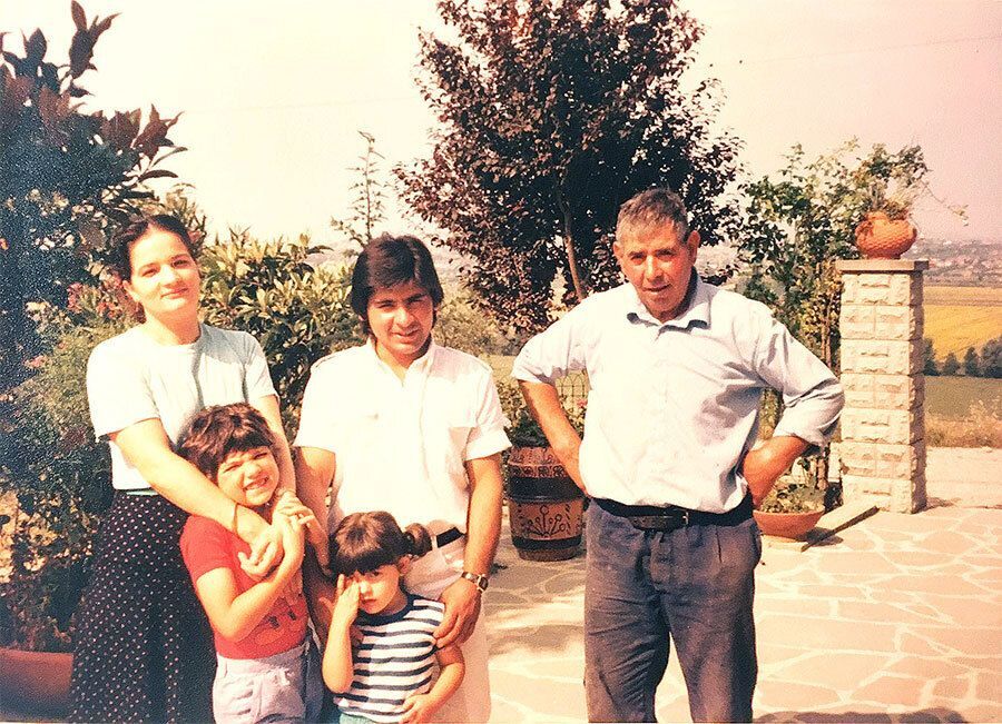 Three generations of the Cucca family in the courtyard of their home