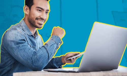 A man sitting at his computer and looking happy about his new design