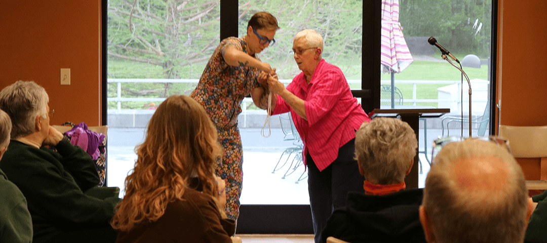 Michelle serves as Sister Marcia's magician's assistant for a couple tricks.