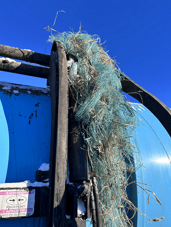 Net Wrap Caught in Collection Truck Arm
