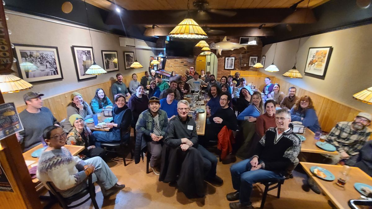 [Image Description: MCC staff gather at Colombo's Pizza Restaurant]