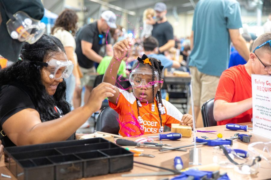 People crafting name signs.