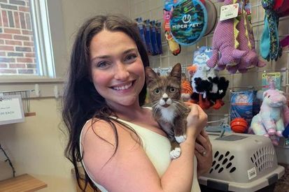 Woman adopting a cat