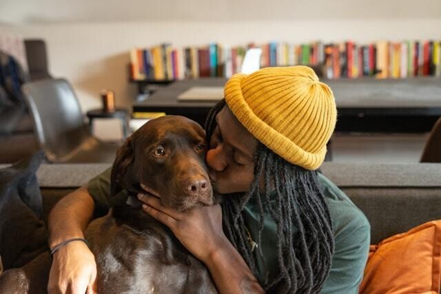 Man Hugging a Dog