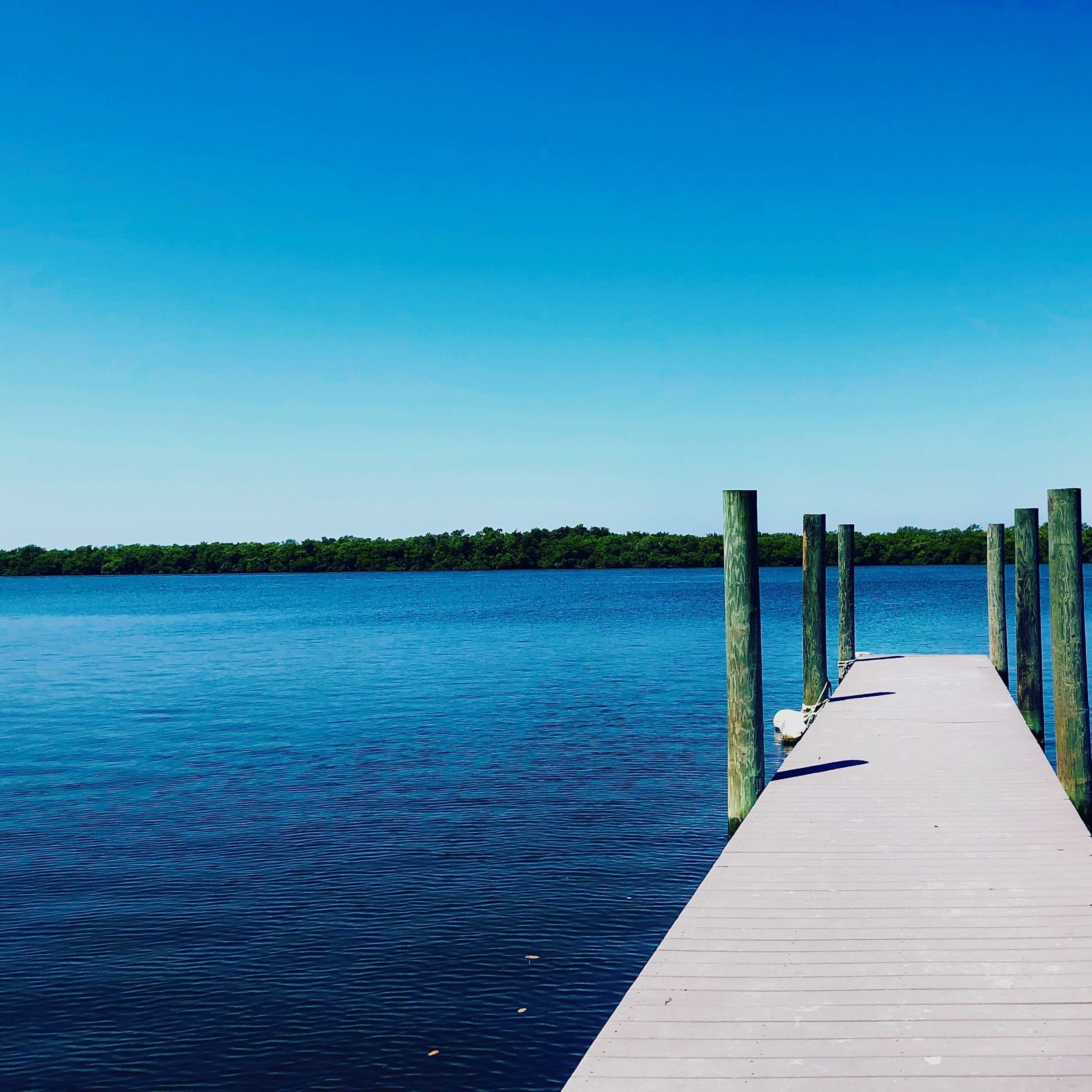 Long dock out over the blue water.