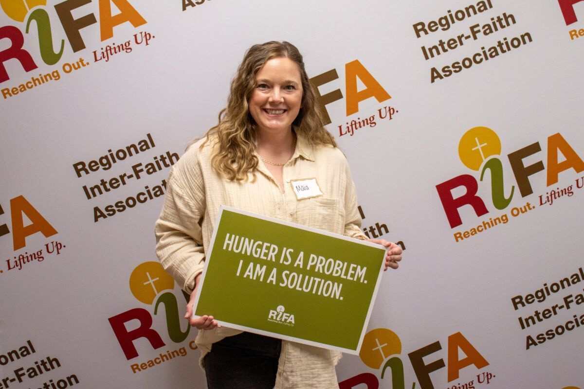 Woman holding a sign