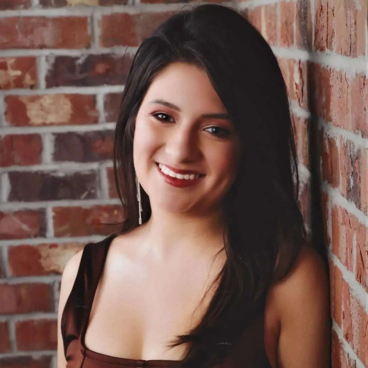 Gabriela Palacios smiling at camera.