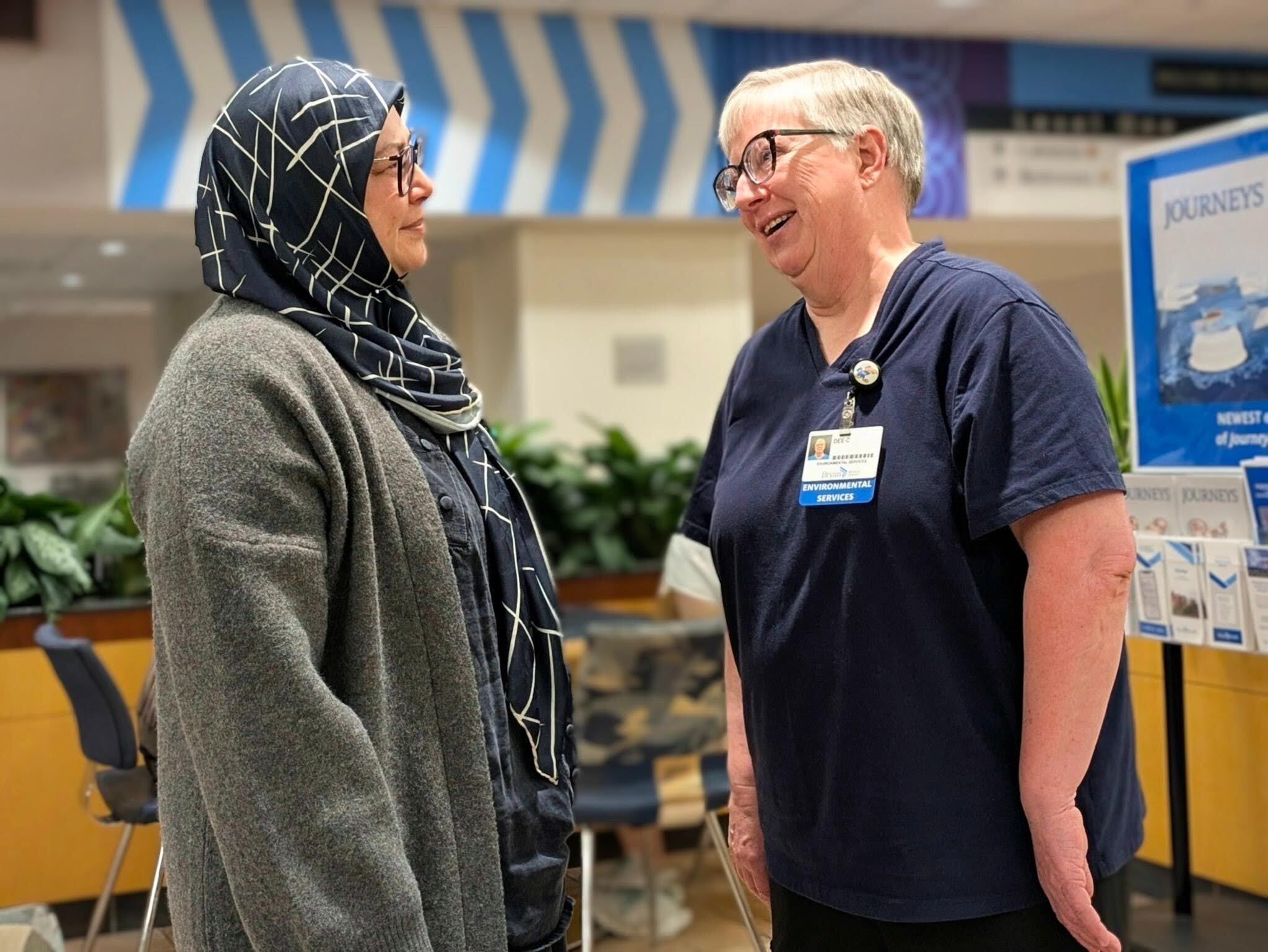cardiac patient monitor, greets her former EVS supervisor, Dee Clark, at Bryan Medical Center East Campus