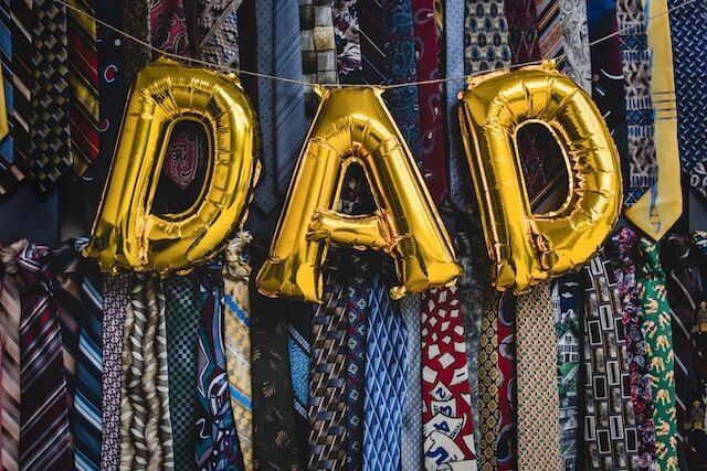 Gold Dad balloons and ties