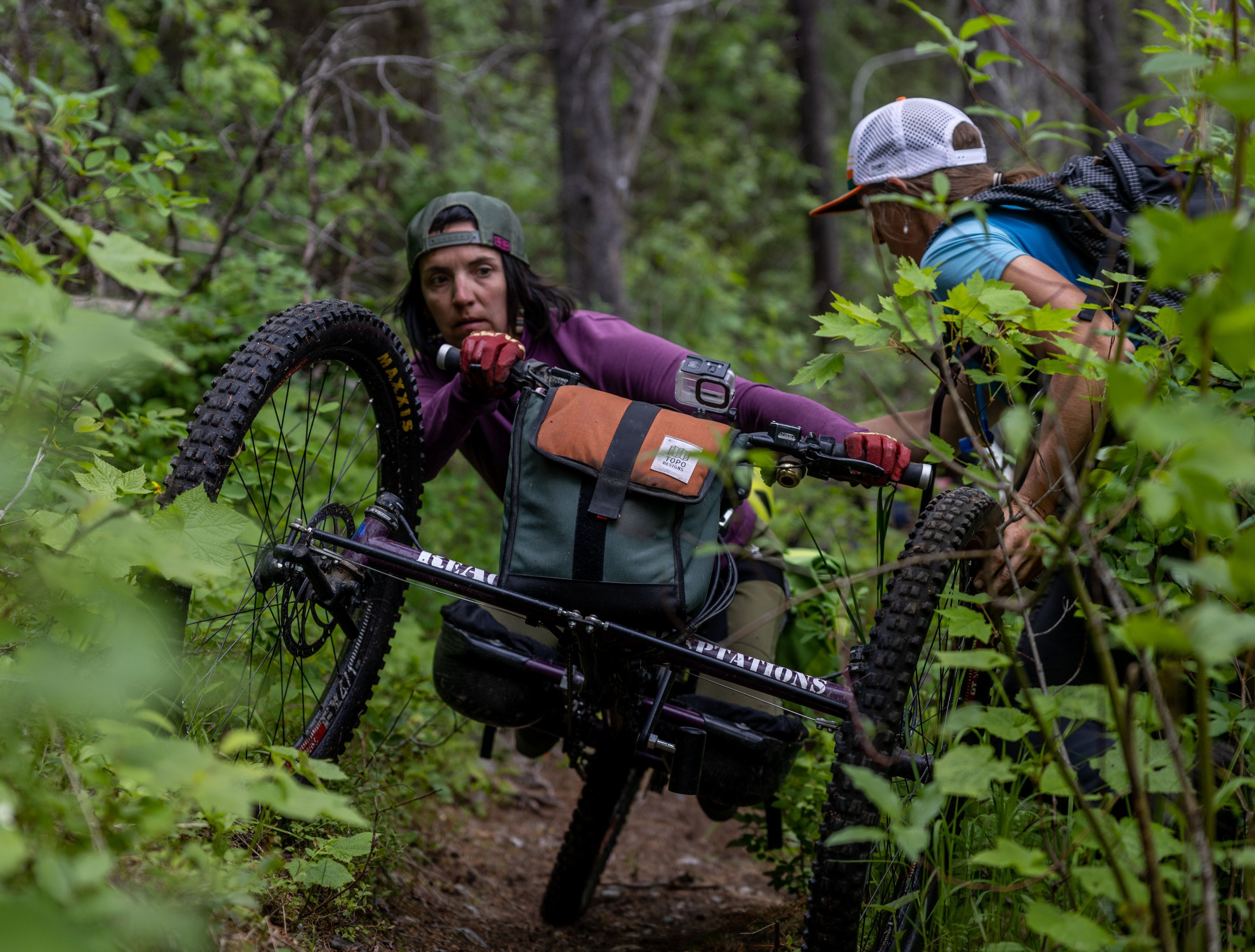 woman on a hand-cycle in the woods