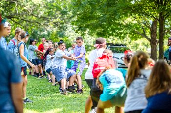Campers play tug-of-war.