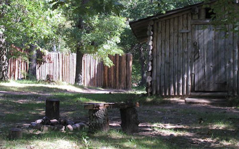 Log cabin with spot to gather around the fire.