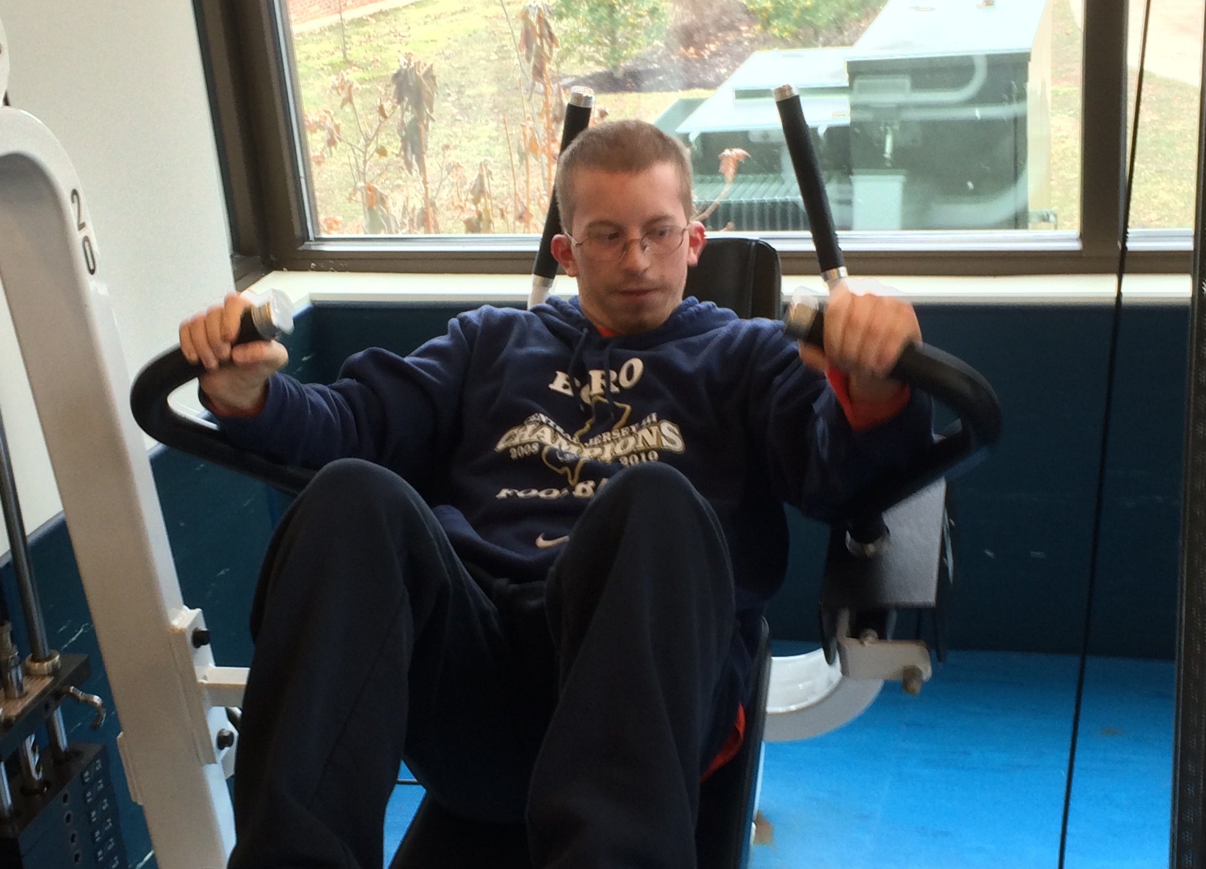 Working out on a strength training machine