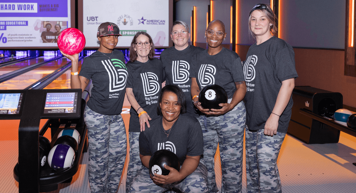 Two bowlers bowling next to each other.