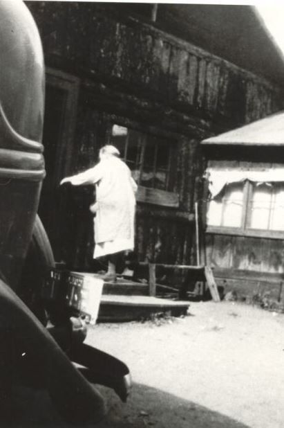 Cora Boegel is shown entering the door of the kitchen 1930s
