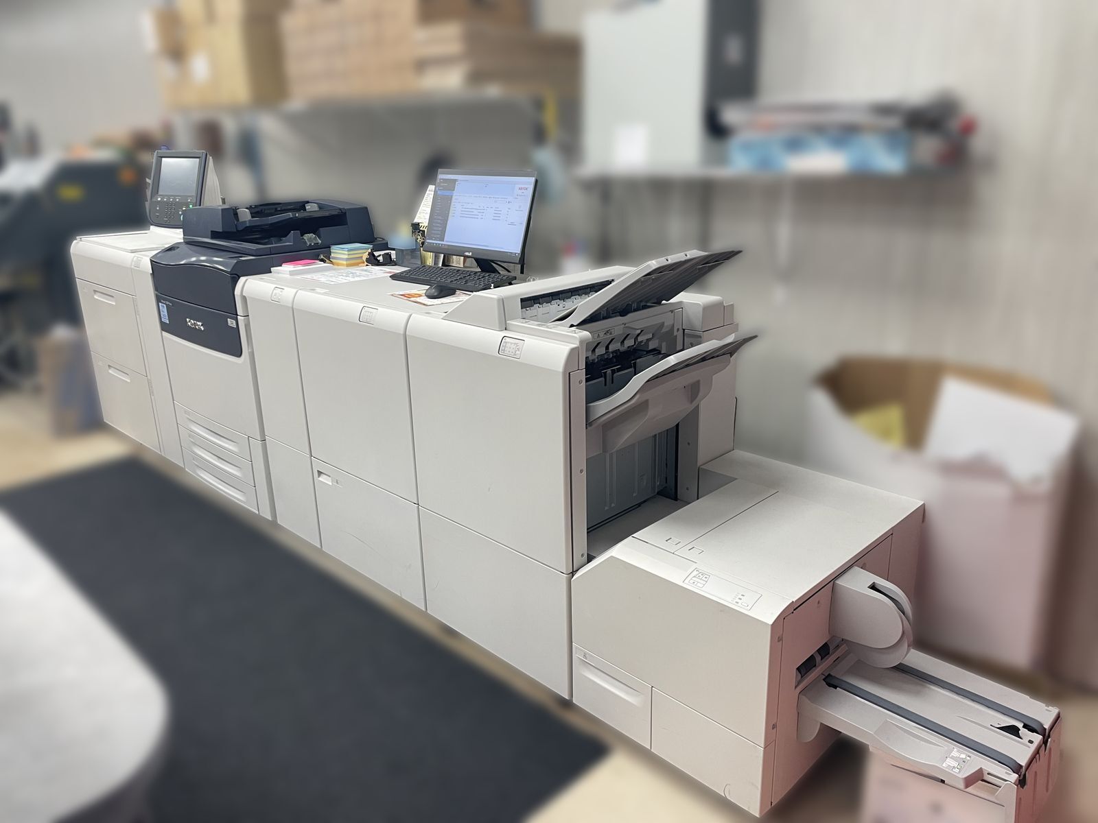 A long grey copier machine