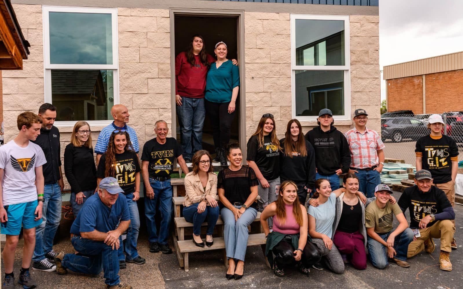 Jewels and the volunteers and staff before craning her house into its foundation.