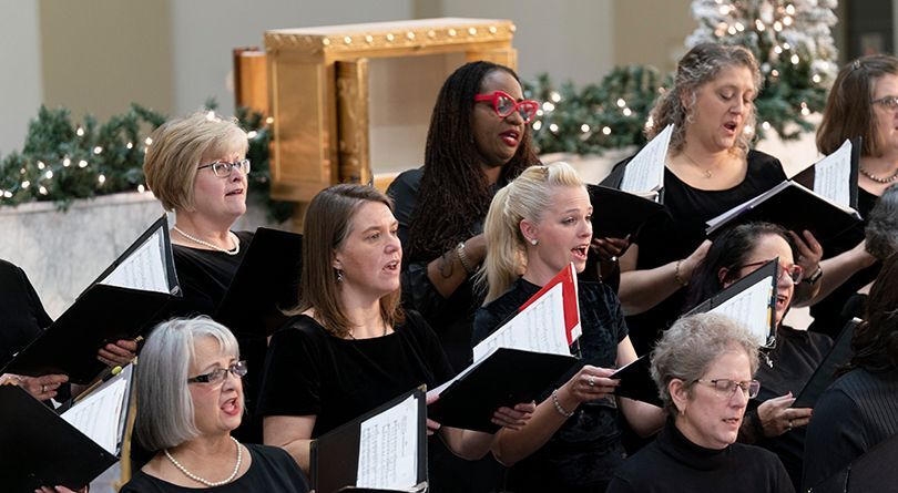 Women singing in a choir.