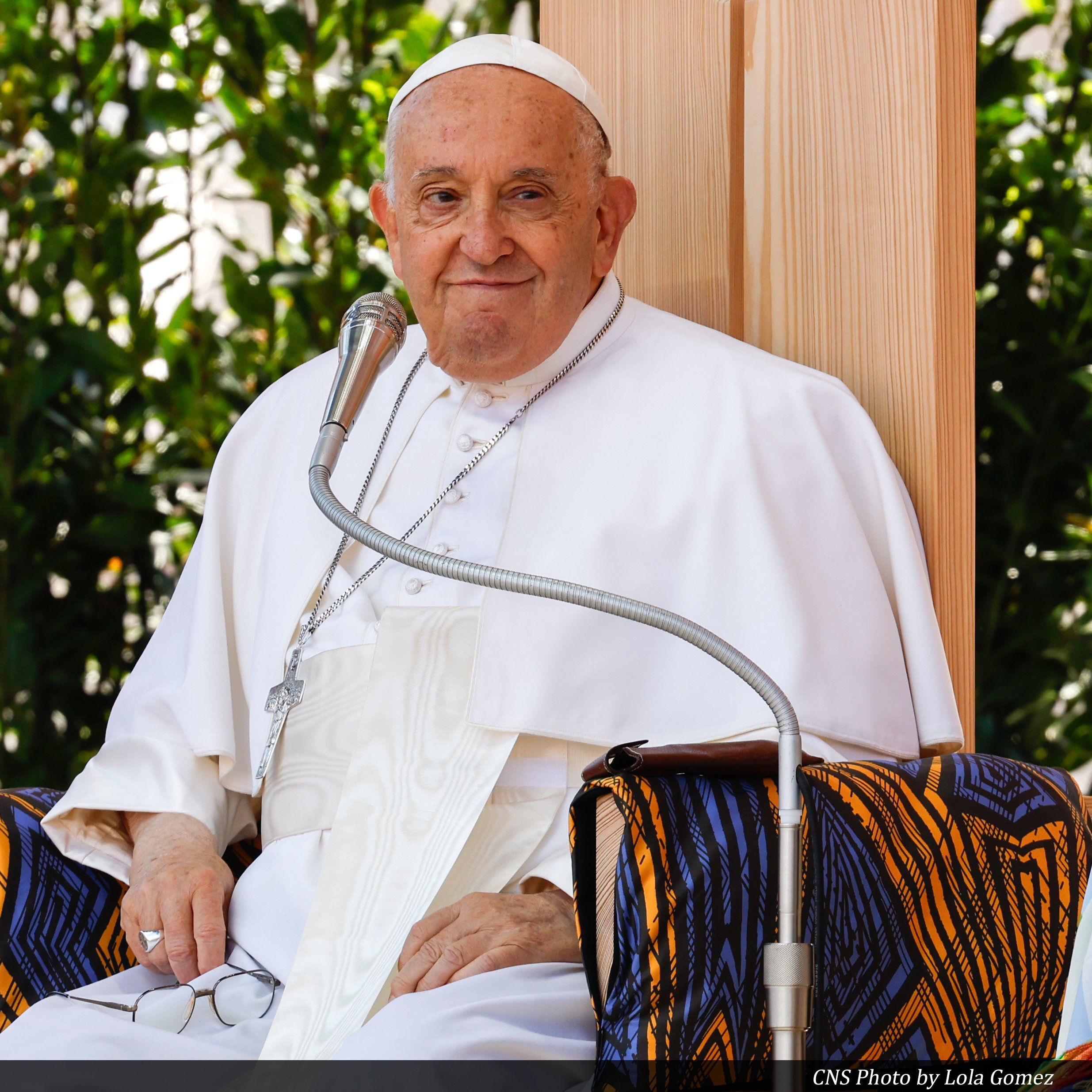 Pope Francis smiles as he participates in a meeting of popular movements and church groups committed to working for peace and justice at the Arena in Verona May 18, 2024. (CNS photo/Lola Gomez)