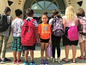 Children with backpacks