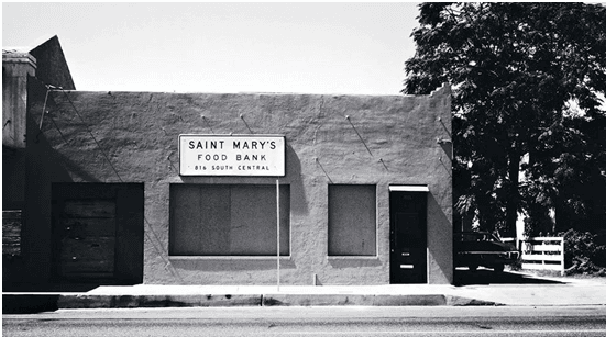 Black and white photo of St Mary's Food Bank in an old bakery building