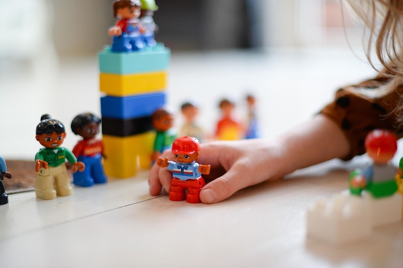Kid Playing with toys - showing hand only