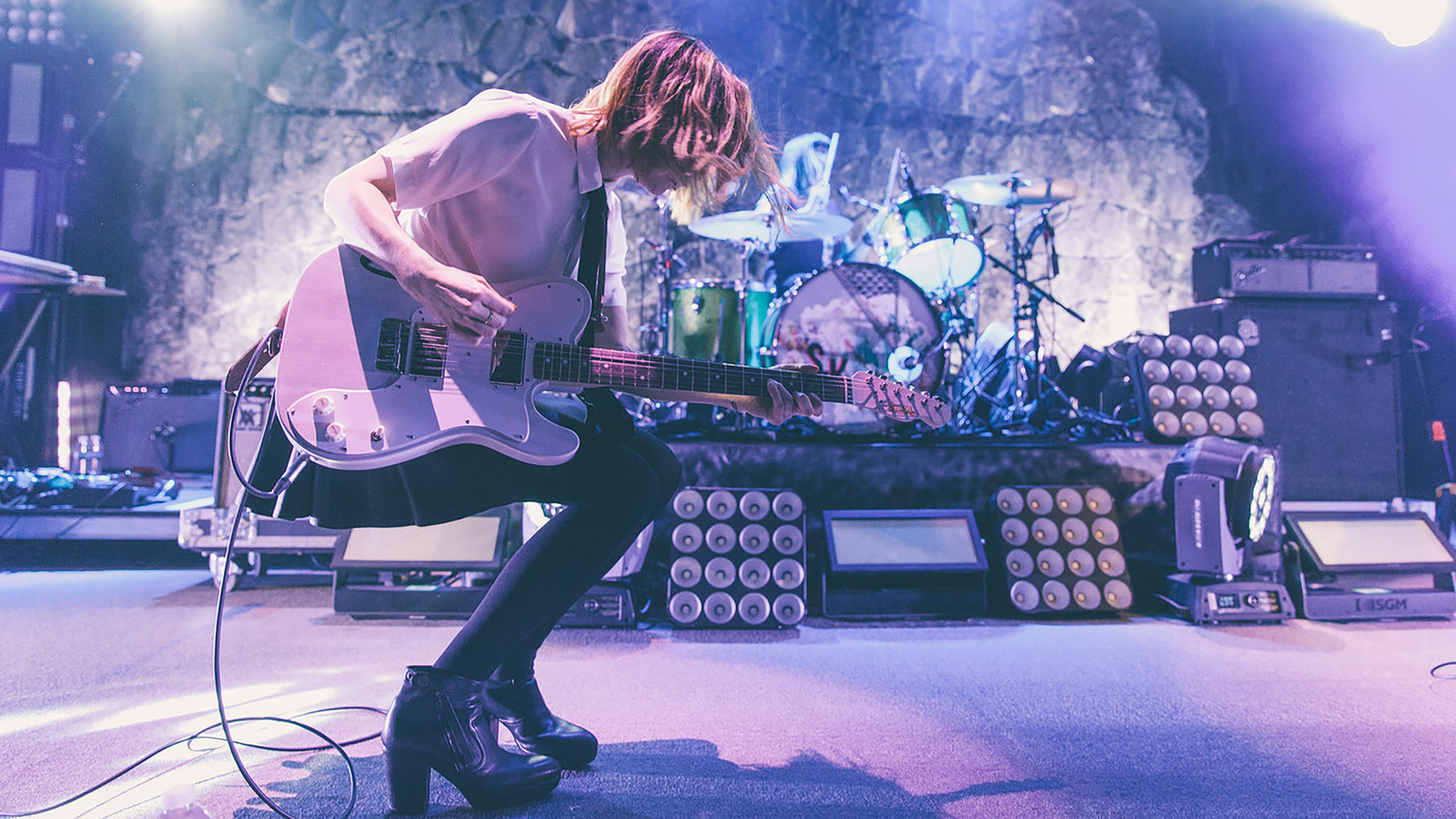 Carrie playing with Sleater-Kinney. (photo: Brigitte Sire)